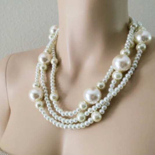 Three strands of ivory pearls in cream shades