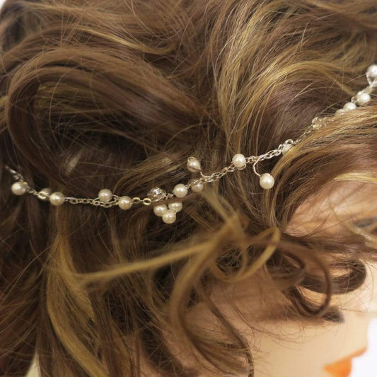 Handmade vintage-inspired bridal headpiece with small pearls, beads, and crystals