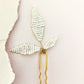 Boho Versatile hairpiece featuring three beaded leaves on a hairpin, ideal for subtle or statement styles.