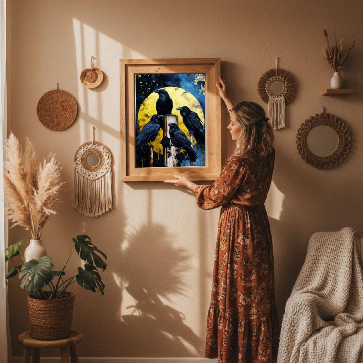 Rustic crow and moon wall art displayed in cozy boho living room, pampas grass and warm golden light. 24x36" digital download poster to print easily as a cozy holiday home decor by Keepsly