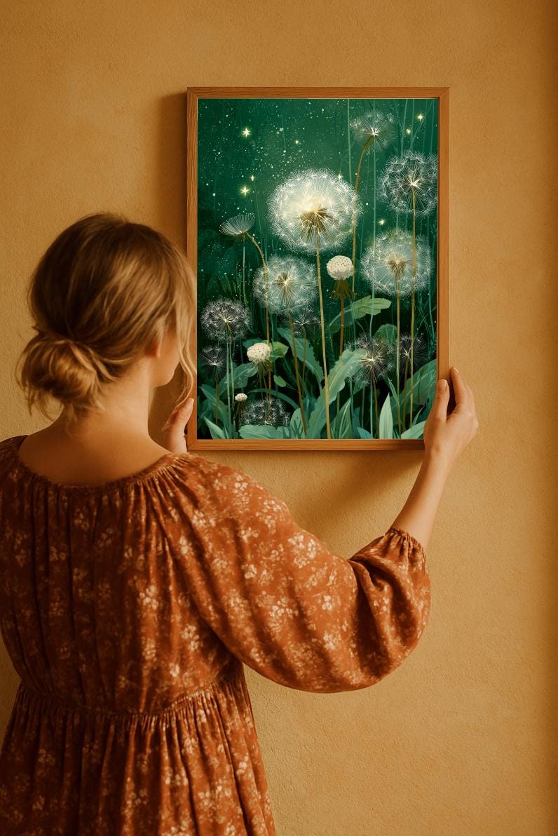 Flowery dressed bohemian woman with loose hair bun is holding the framed digital poster on a warm color wall. She is looking at the emerald green background dandelion wall art. There is a perfect macthing fall colors combination in the photo.