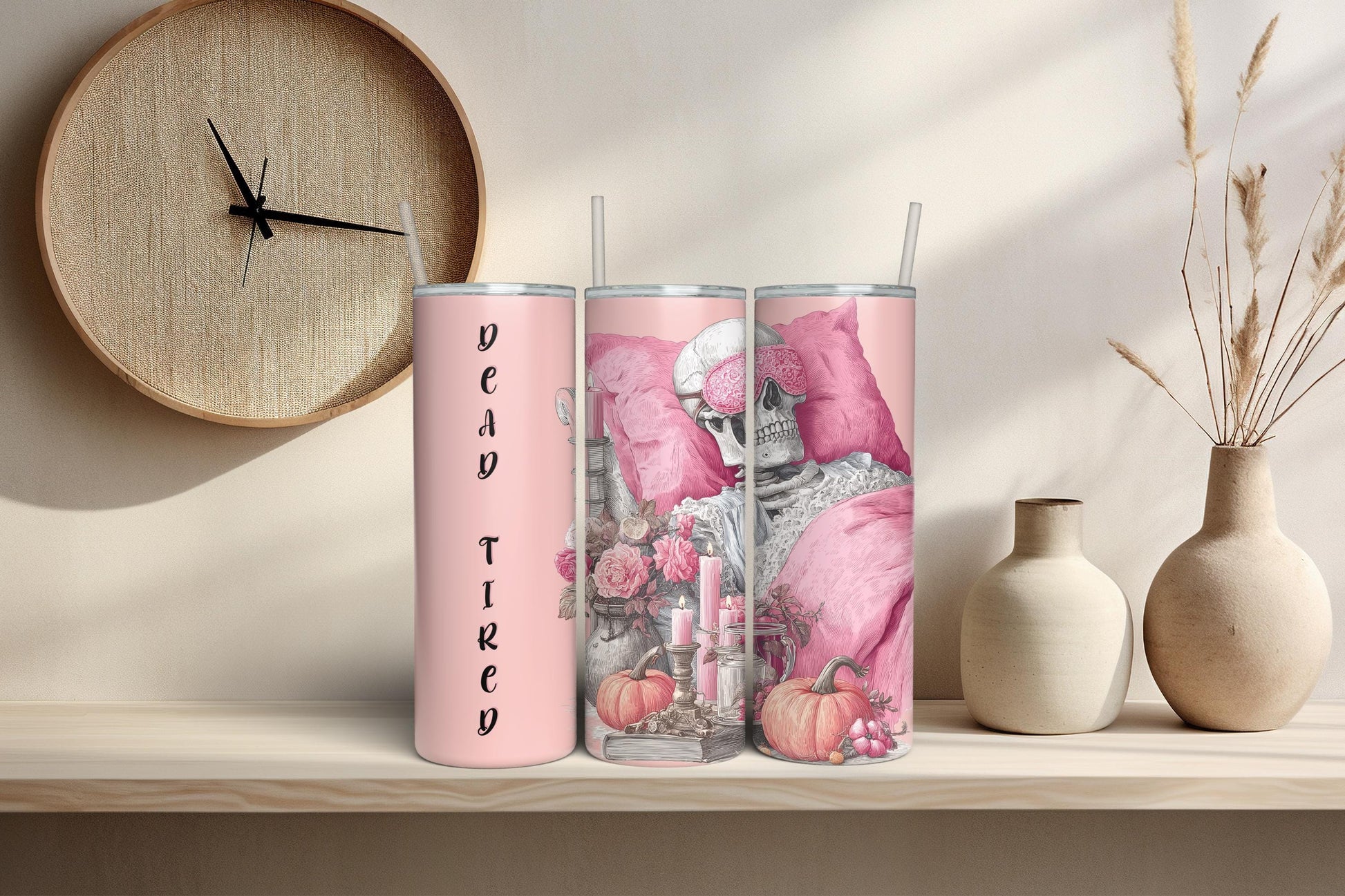 Pink cozy skeleton tumbler design with pumpkins, roses and candles, displayed in warm natural lighting for sublimation tumbler preview.
