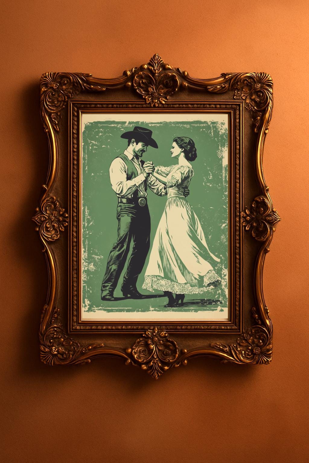 A retro style cowboy with a hat and a cowgirl in a lace dress are dancing on a vintage green, distressed background. The wall art is in the antique bronze frame.