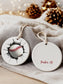 Personalized cracked baseball ornament with custom name on cloth background, sports-themed Christmas gift