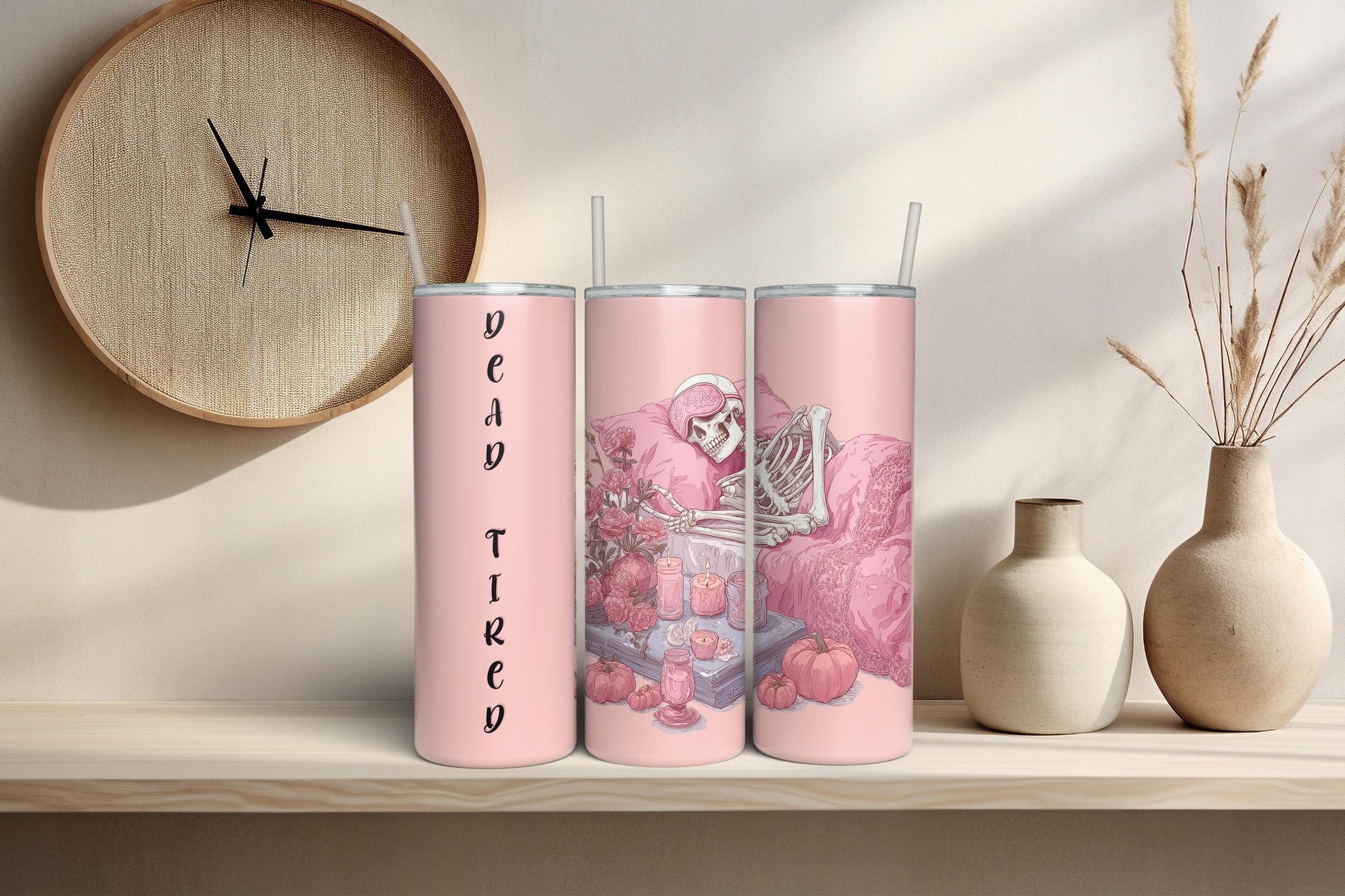 Set of three pink gothic skeleton tumblers with floral and candle details, featuring ‘Overthinking’ and ‘In Peace’ text in a cozy aesthetic room