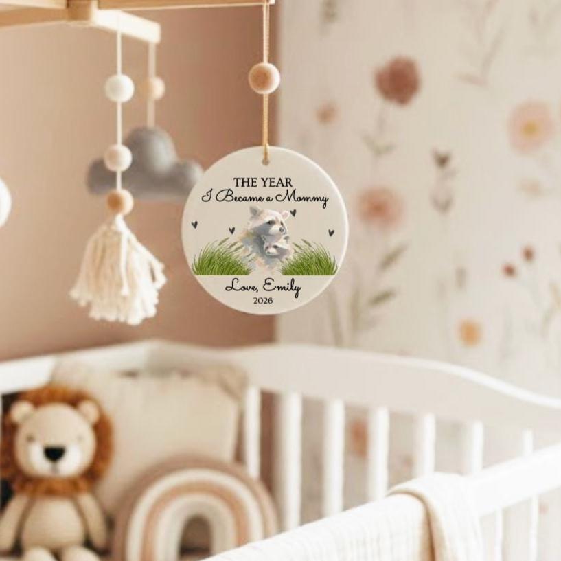 The Year I Became First Mother's Day Ornament, Watercolor Raccoon Mom Keepsake 2026