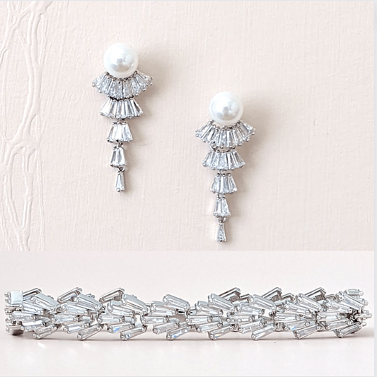 Flapper design vintage bridal earrings with baguette cubic zirconium and pearls. Perfect accessory for any wedding dress style. Subtle yet eye-catching. Available in silver and gold finishes